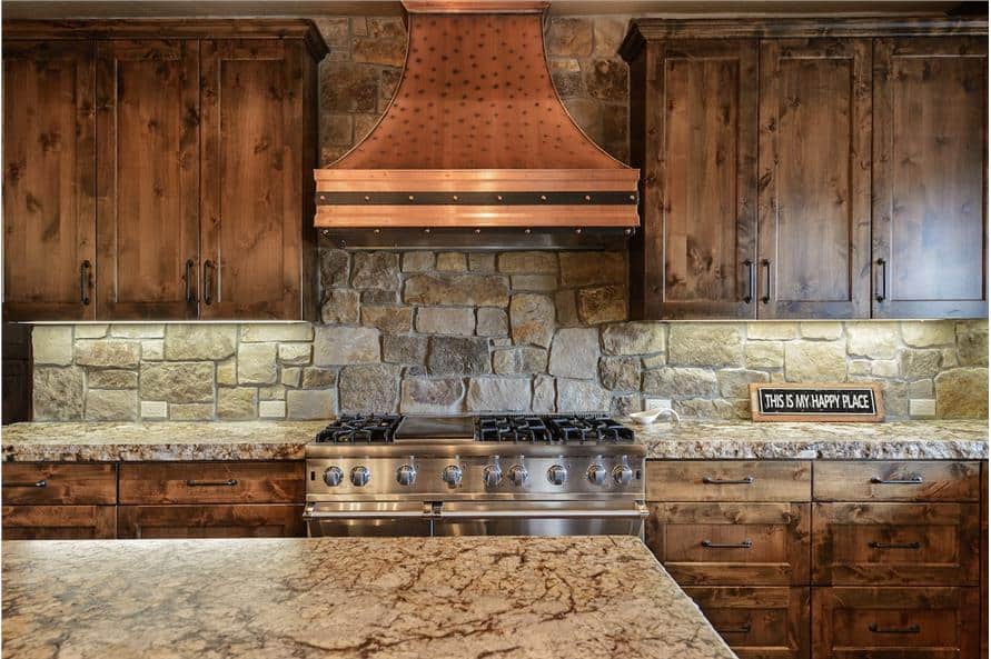 A closer look at the copper vent hood and cooking range.