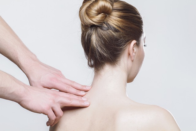 Woman getting a neck and shoulder massage.