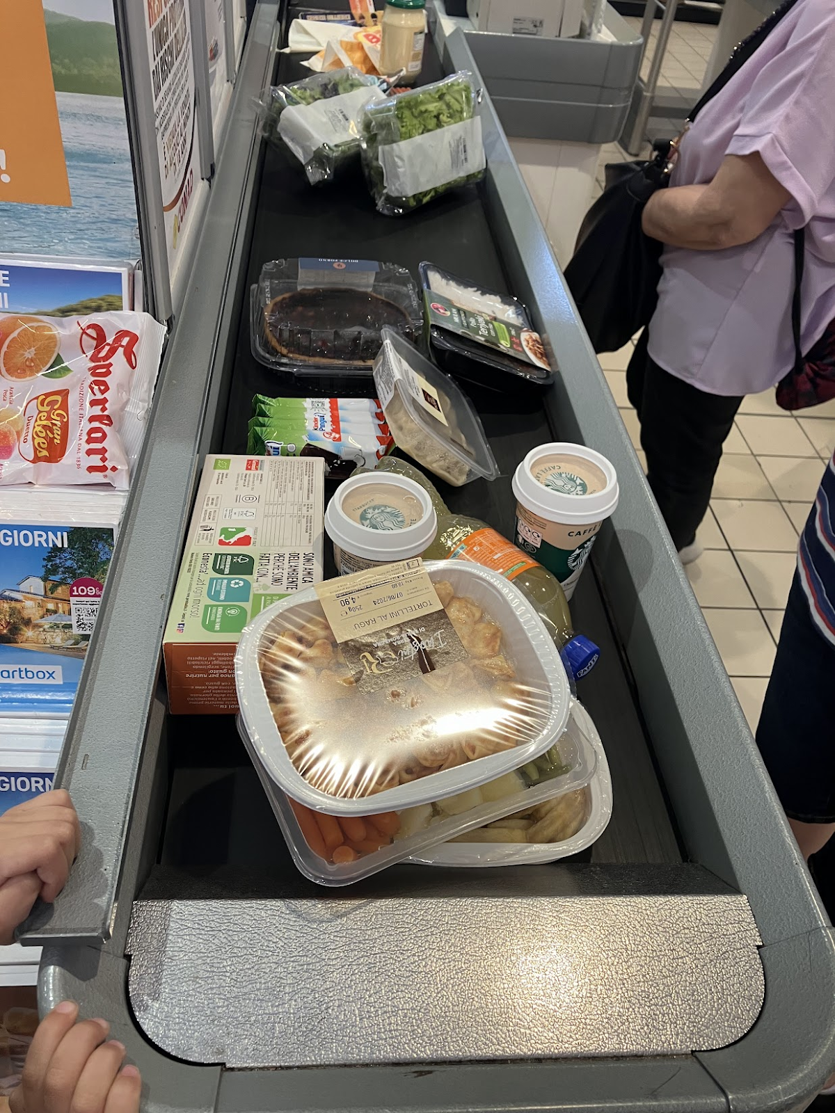 a narrow grocery store belt at a grocery store in bologna italy