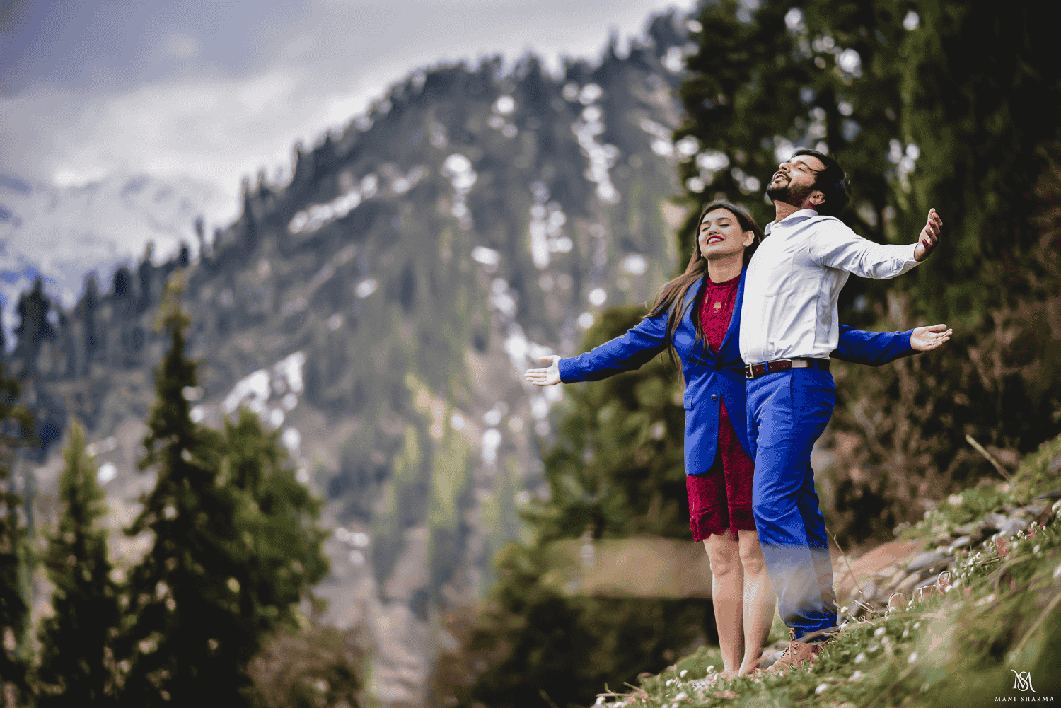 Pre wedding shoot of a couple in Solang Valley, smiling and feeling beauty of the nature