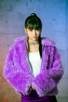 This contains an image of Nana with a purple jacket and a white inner with a beautiful necklace