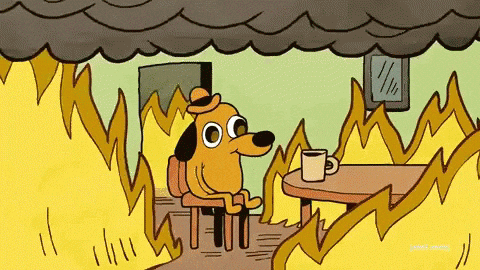 Gif of dog sitting in fire saying "this is fine"