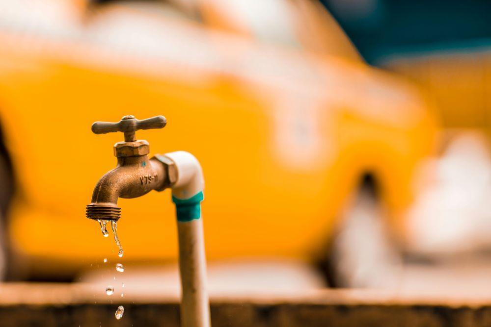 An old faucet with water