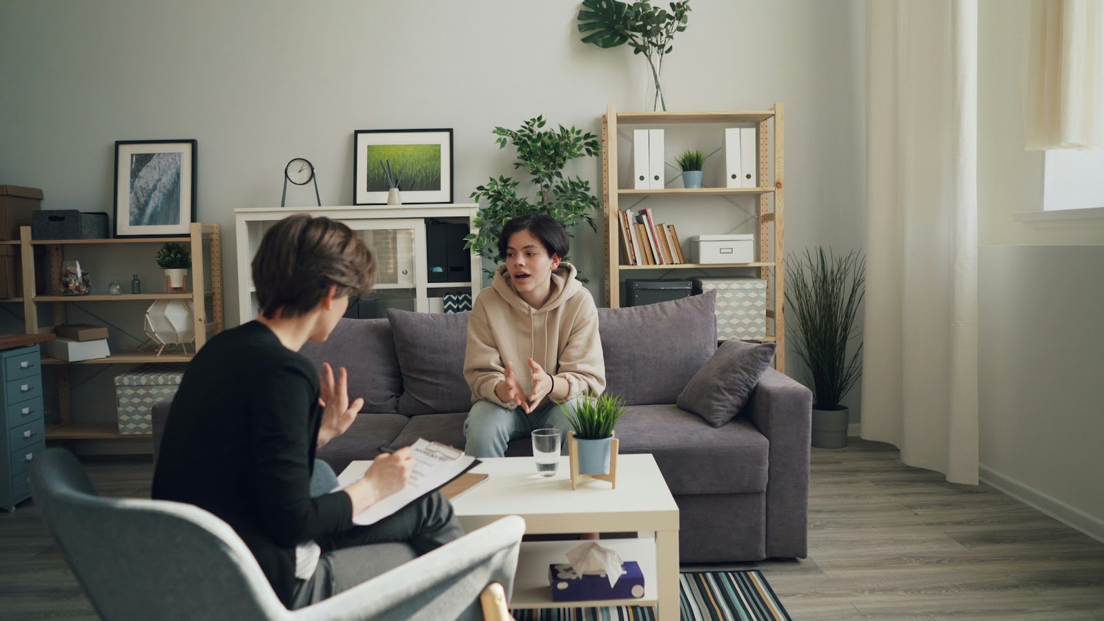 Interior designer discussing plans with homeowner.