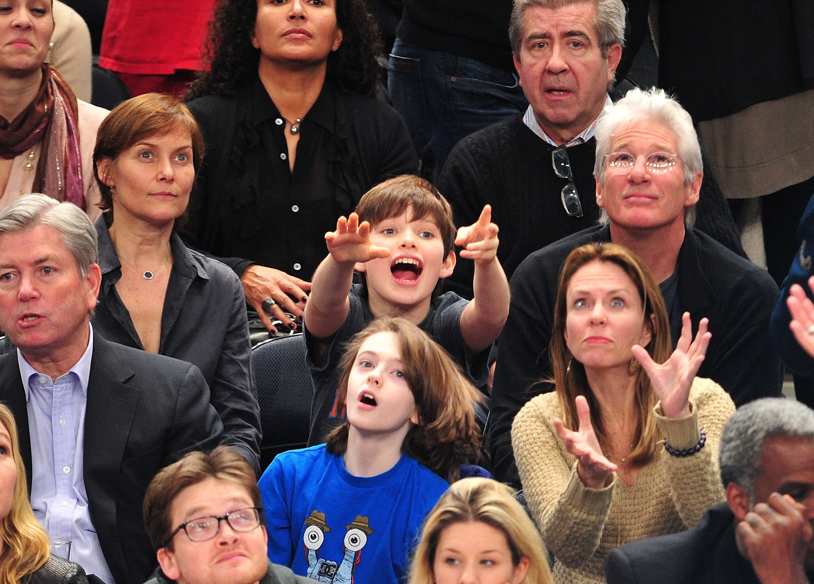 Carey Lowell, Homer James Gere, and Richard Gere were seen watching a game between the Chicago Bulls and New York Knicks at Madison Square Garden on February 2, 2012. | Source: Getty Images