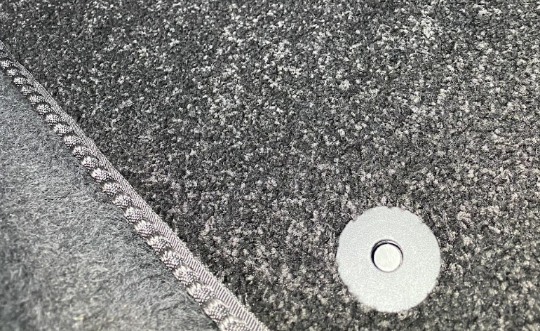 Close up of car mat clip