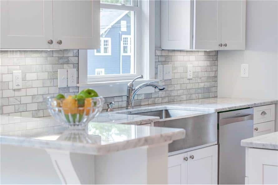 A closer look at the farmhouse sink paired with chrome fixtures.