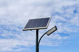 A solar panel on a pole

Description automatically generated