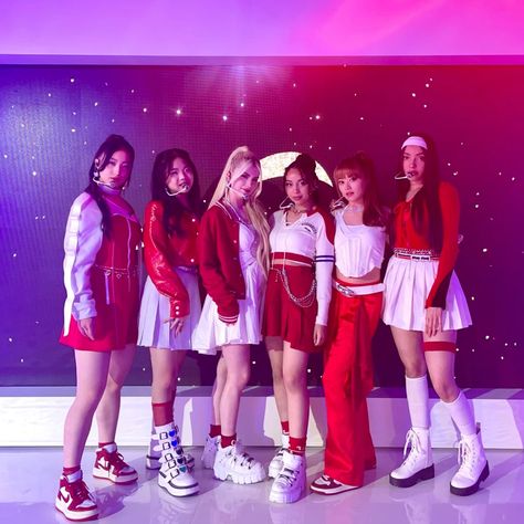 This may contain: the girls are dressed in red and white outfits