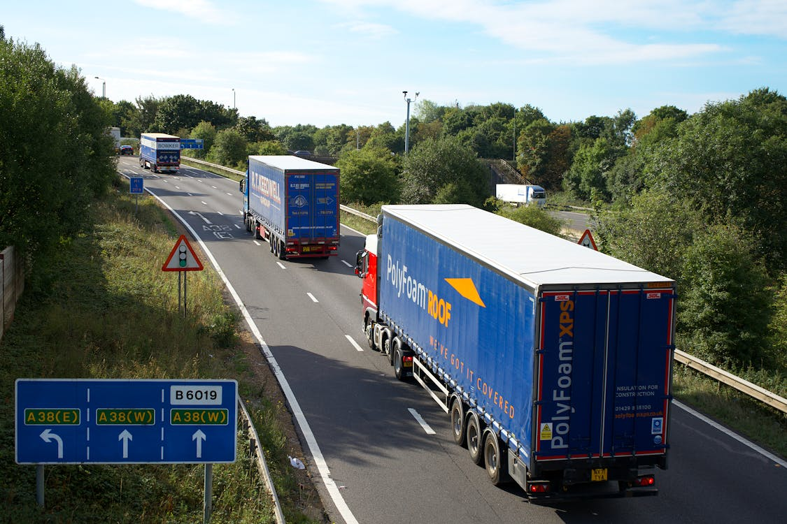 A Cargo Trucks Moving on the Road