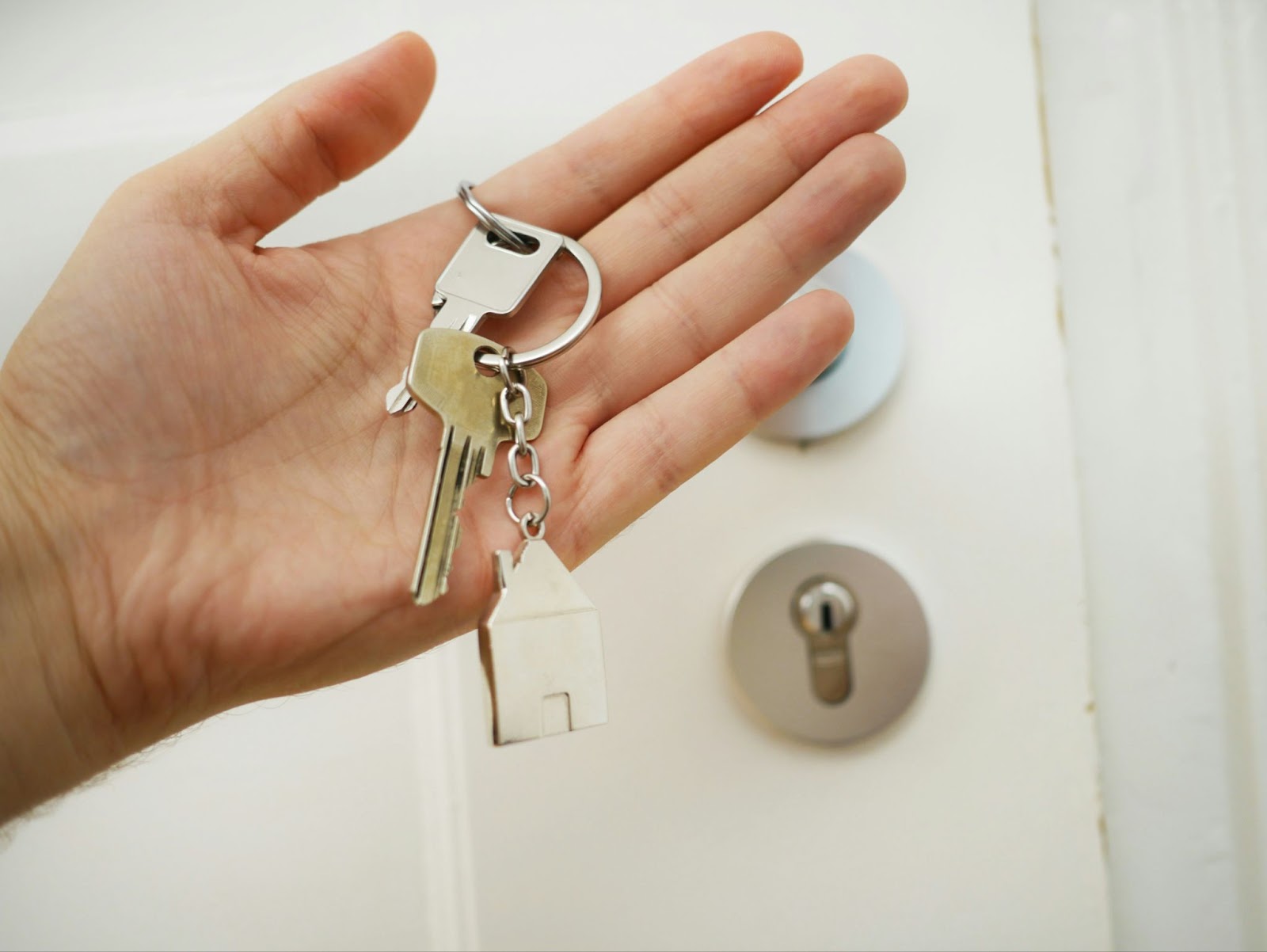 A buyer holding the keys to their new home