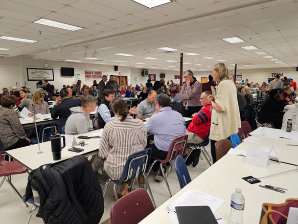 Dr. Reid speaking with parents at a Boundary Review Community meeting at Mount Vernon High School. 