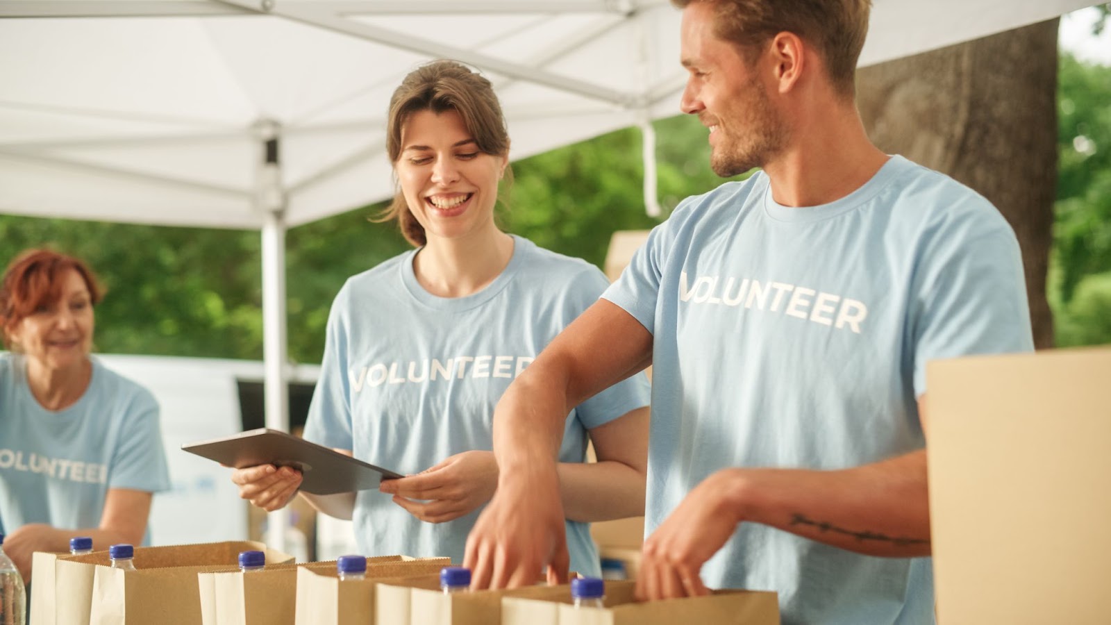 Several employees volunteering at a food event