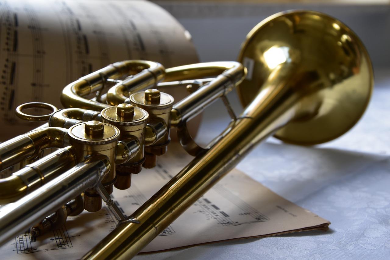A trumpet on a sheet music

Description automatically generated