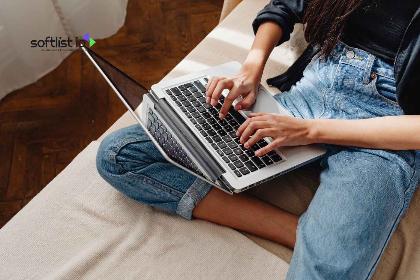 a woman typing on her laptop