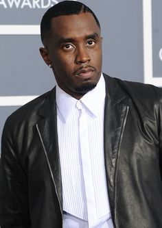 P. Diddy wearing a black jacket and a white inner shirt 