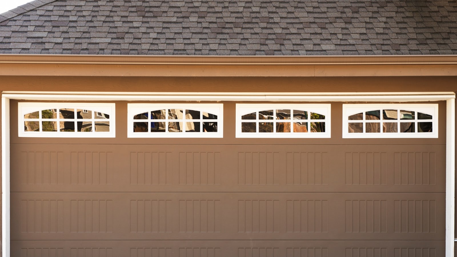 A garage door with tinted windows for added protection.