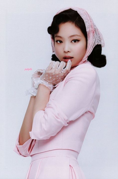 BLACKPINK Jennie wearing a pink shirt,  pink skirt, and a pink hair tie   