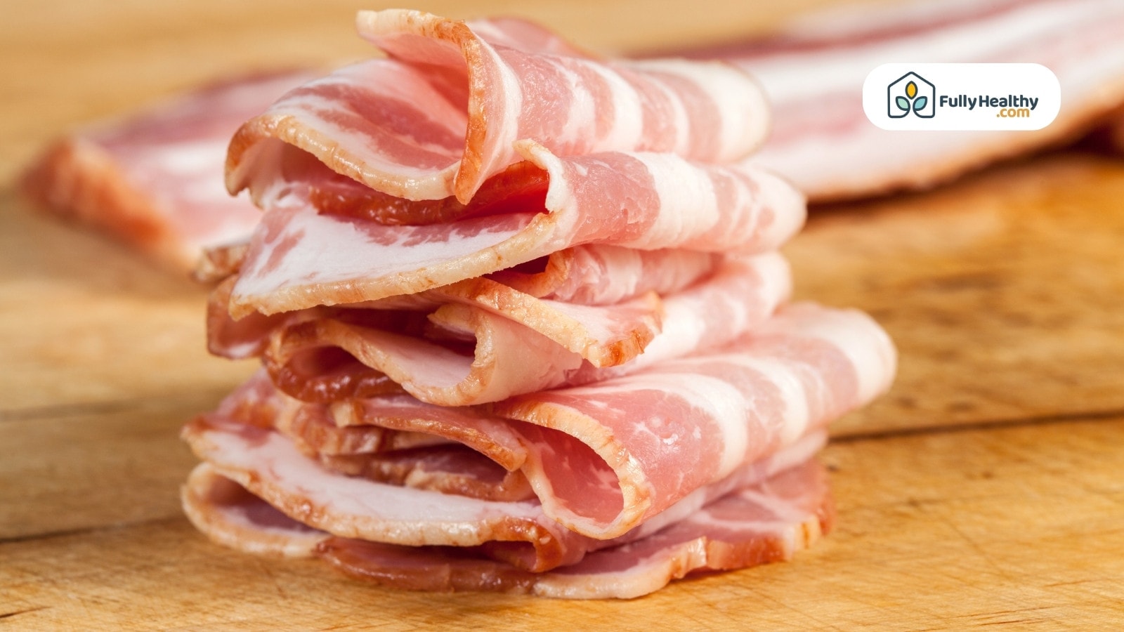 Stacked slices of raw bacon