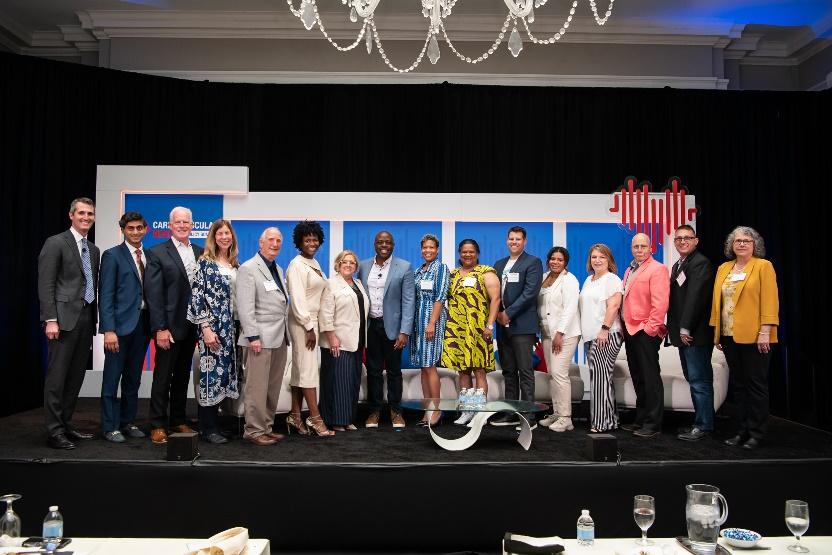 A group of PACH leaders and their CLA members standing on-stage