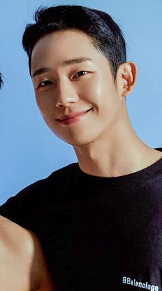 This contains an image of Jung Hae-in on a black outfit looking cute