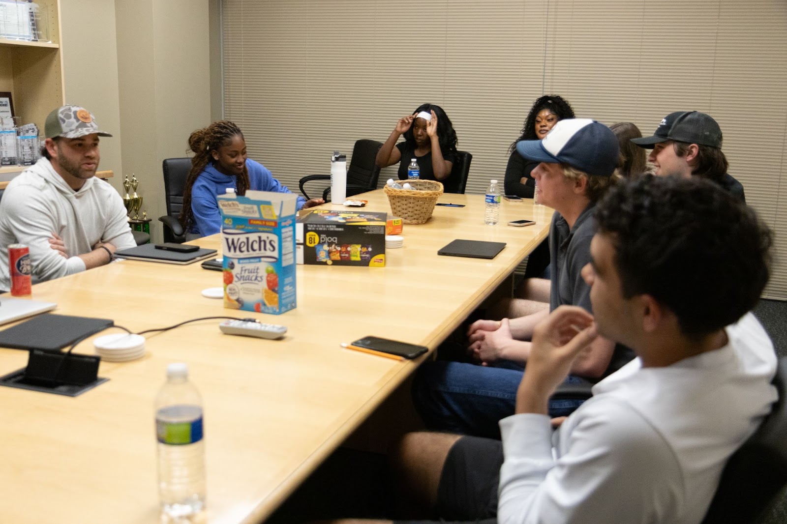Students at a conference table.