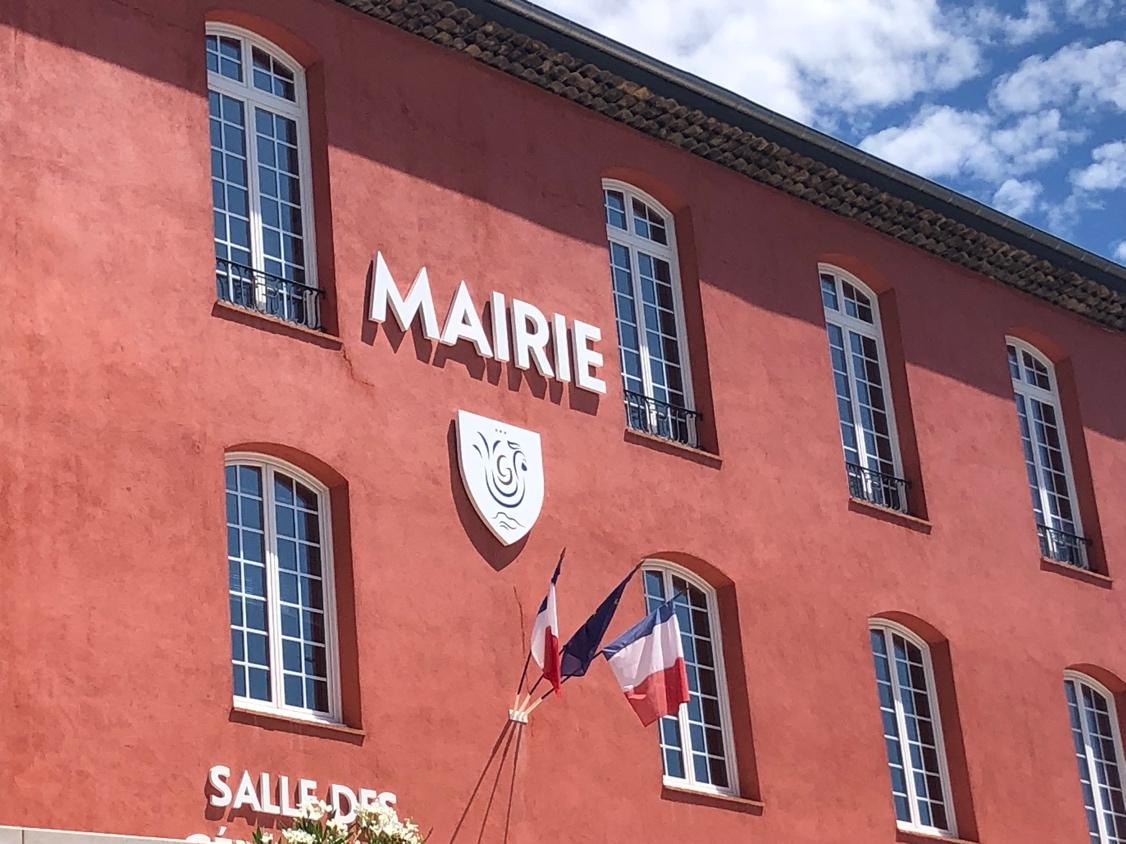 A building with a sign on the front

Description automatically generated