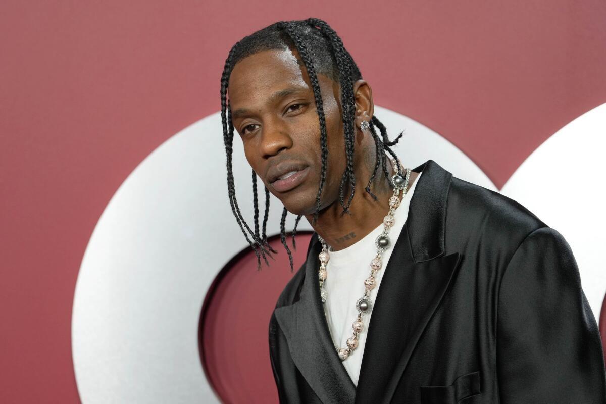 A person with braids wearing a black jacket

AI-generated content may be incorrect.