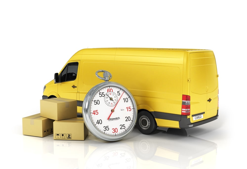 A yellow delivery van with a stop watch and a stack of boxes on the side