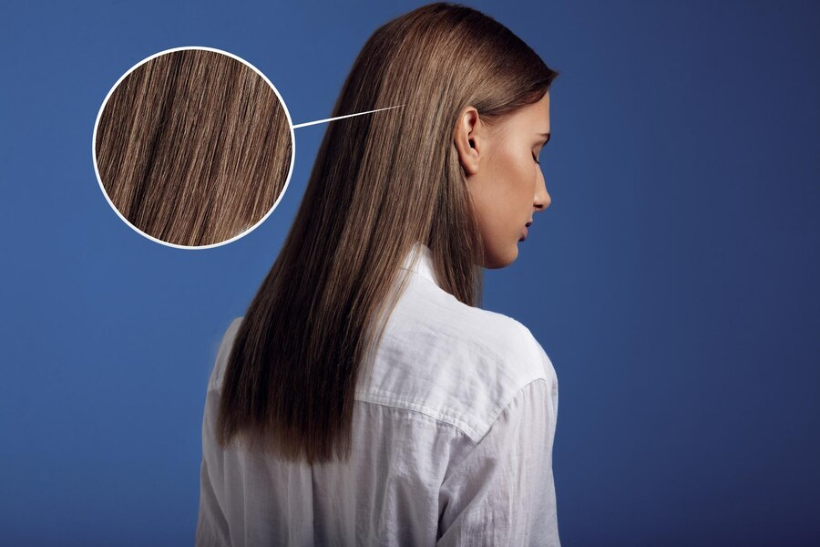 Woman wearing white shirt showing her ideal straight hair