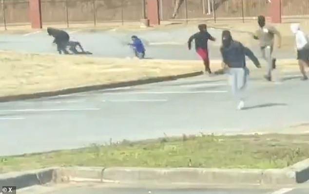 Georgia high school parking lot shooting: Two shot during fight between two  gangs while students were in classes | Daily Mail Online