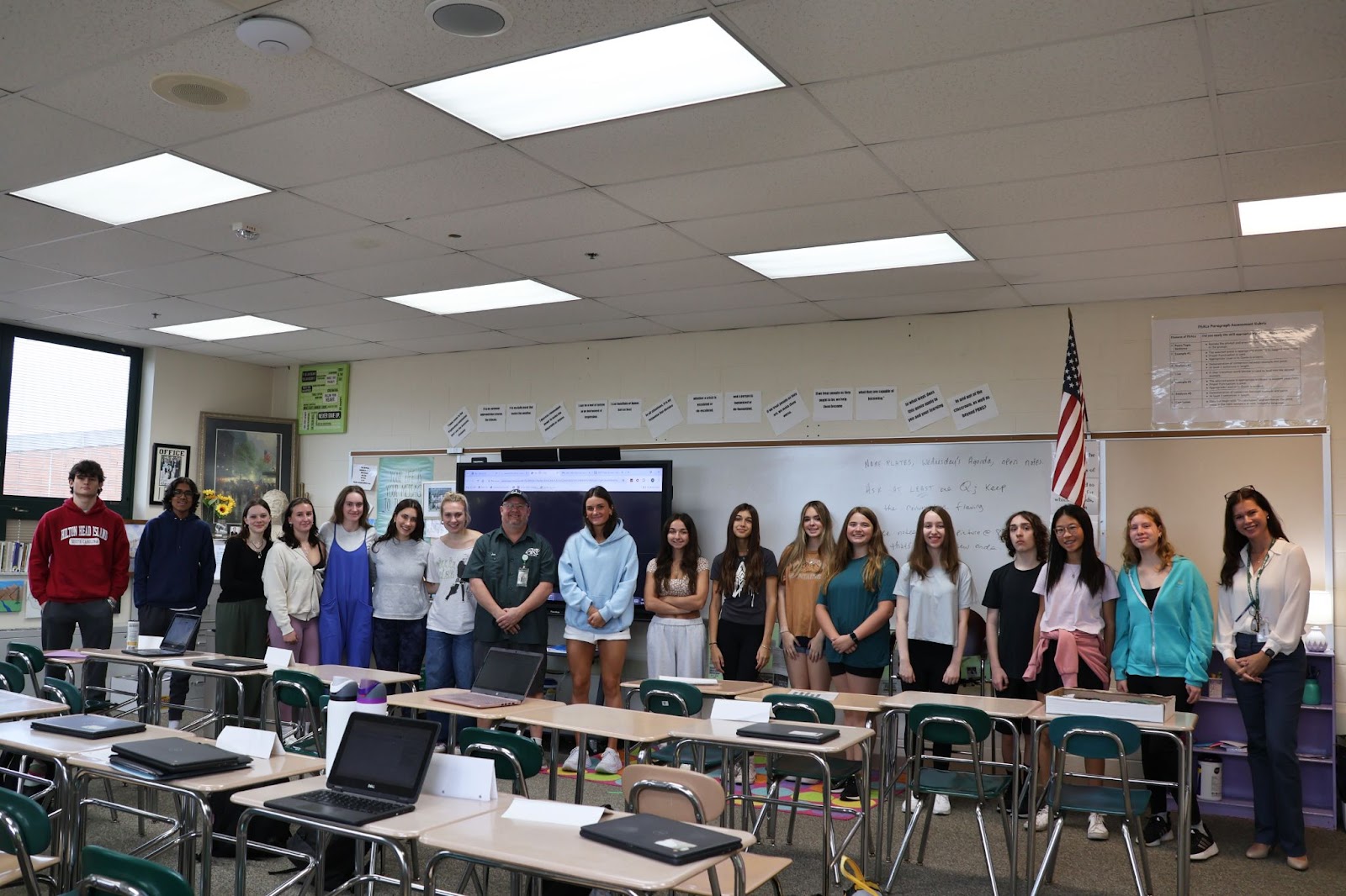 class stands with Joe Strobel against white board