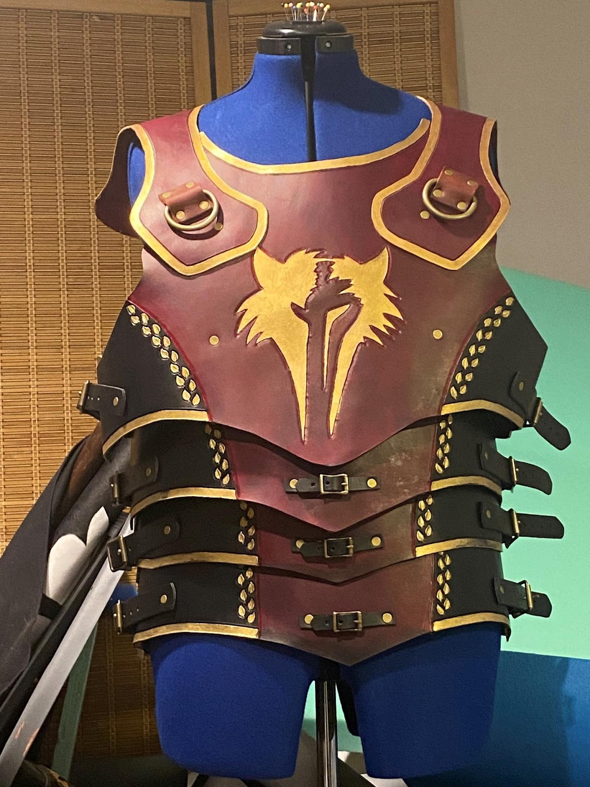 A mannequin wearing a leather armor

Description automatically generated