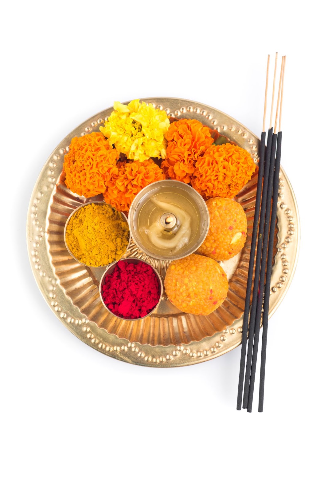 Pooja Thali holding essential items of Gauri Poojan like fresh flowers, incense sticks, prasad, turmeric, diya.