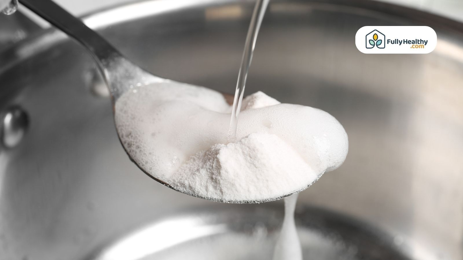 Baking soda being mixed with water forming bubbles