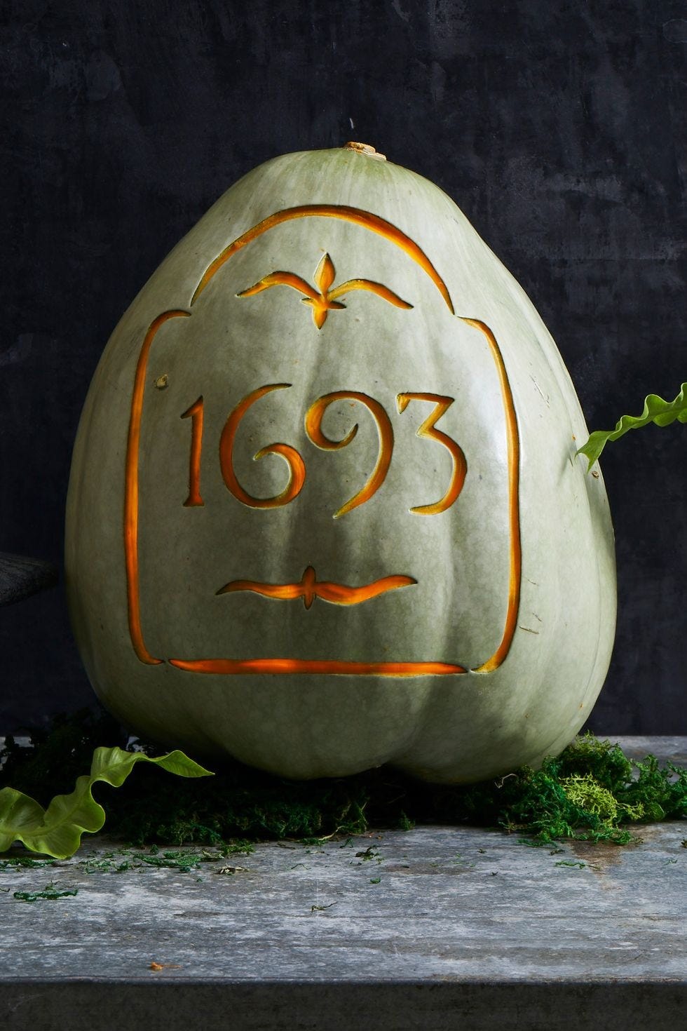 diy halloween decorations, carved headstone pumpkin that reads rip