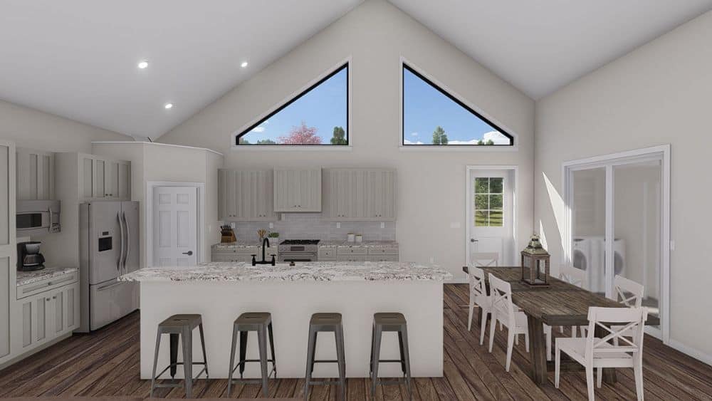 The eat-in kitchen is equipped with slate appliances, white cabinetry, marble countertops, a breakfast bar, and a rectangular dining table.