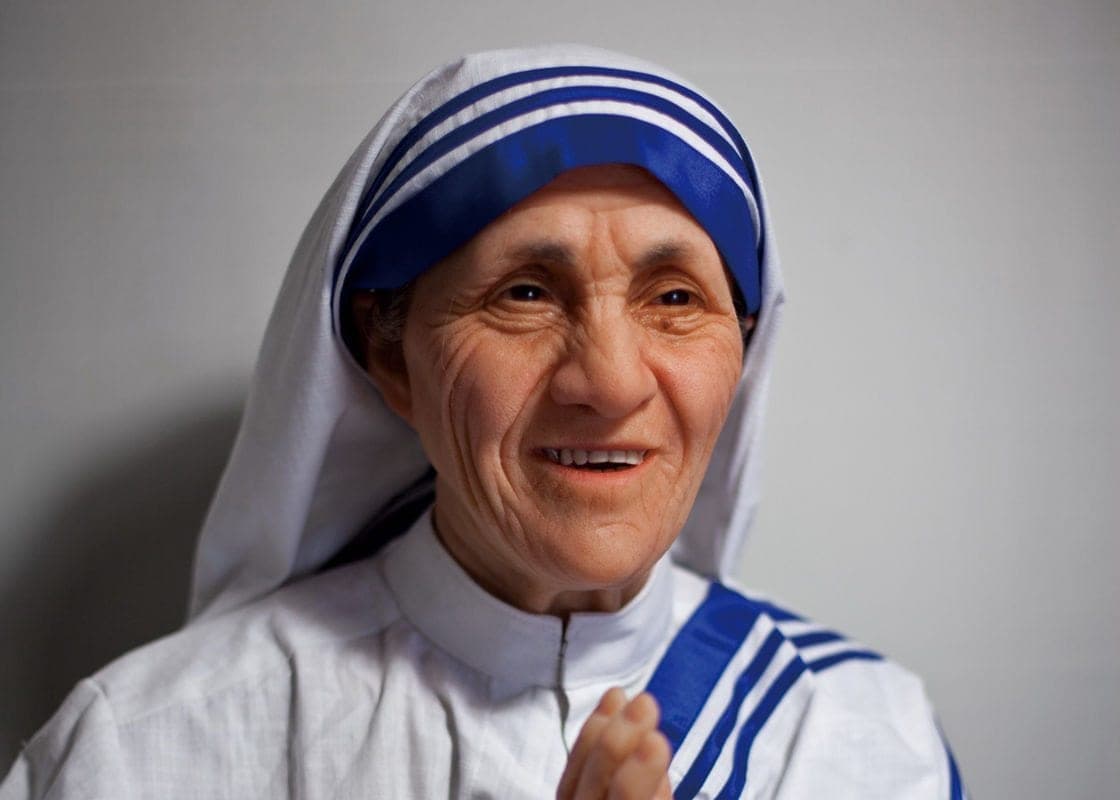 Mother Teresa caring for patients, International Women's Day caregivers tribute