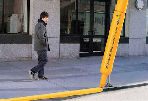 Example of guerilla marketing: a yellow highlighter painting the road