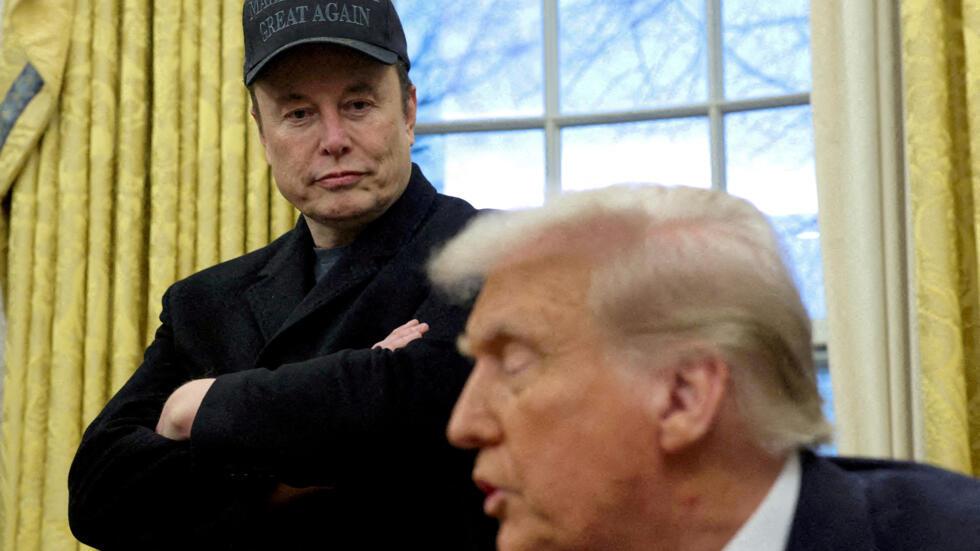 Elon Musk and President Donald Trump are shown in the Oval Office in Washington
