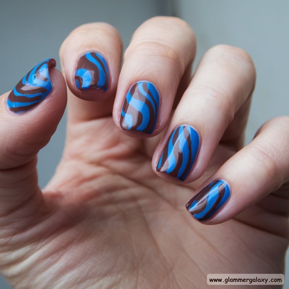 Blue and Brown Nails with Dynamic Swirl Design