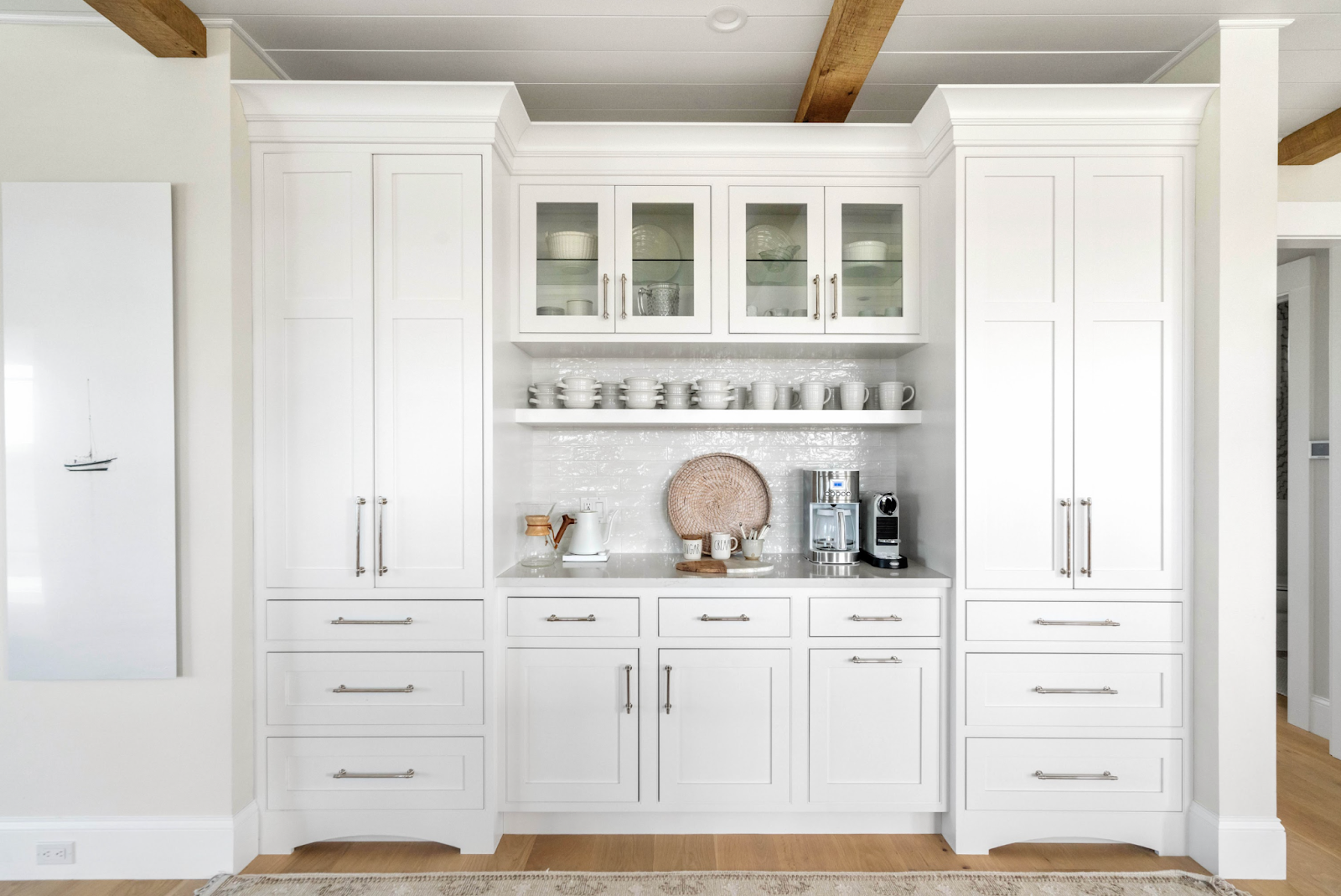 This image depicts a bright and inviting kitchen featuring white recessed panel doors with a classic design.