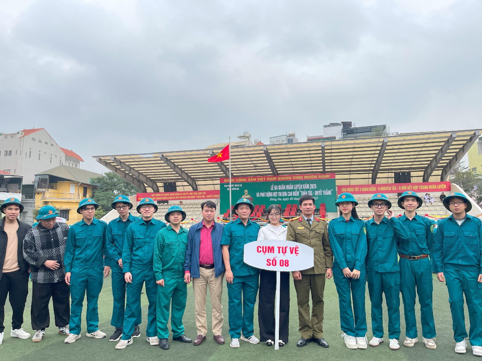 A group of people in matching outfits posing for a photo

AI-generated content may be incorrect.