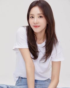 A picture of Sandara Park on a white polo and jean pant 