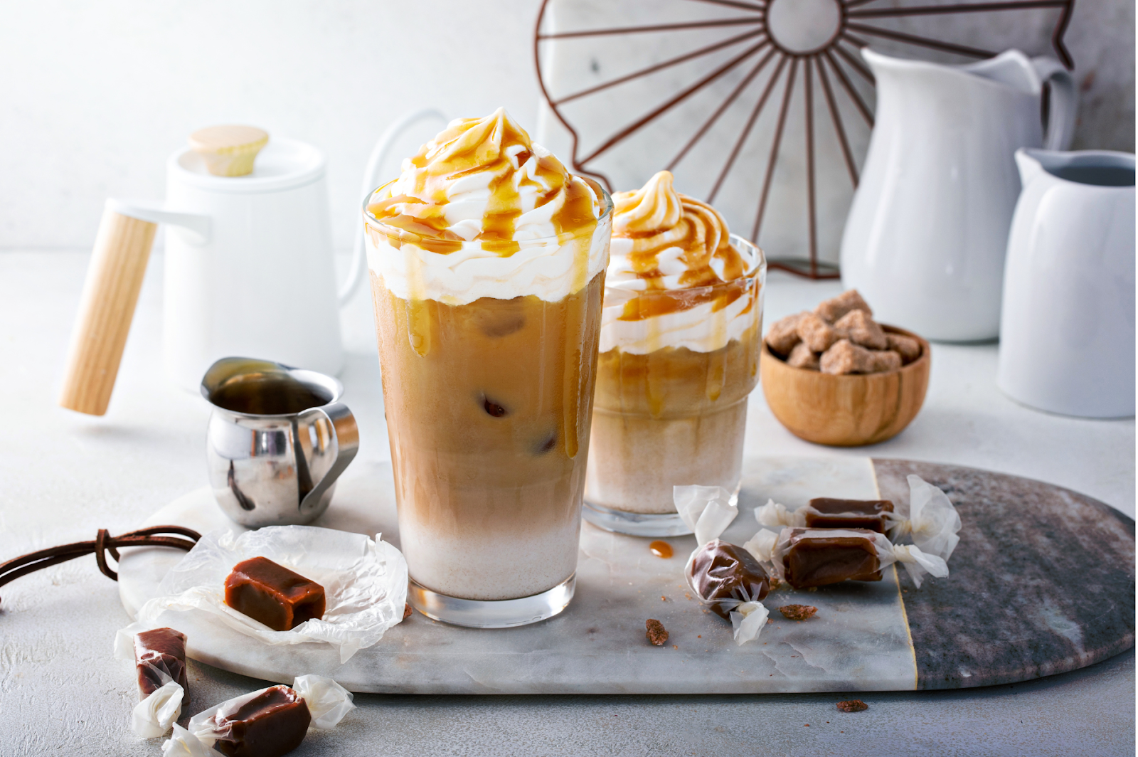 A picture of a delicious Caramel Macchiato, highlighting the layers of coffee, milk, and caramel syrup.