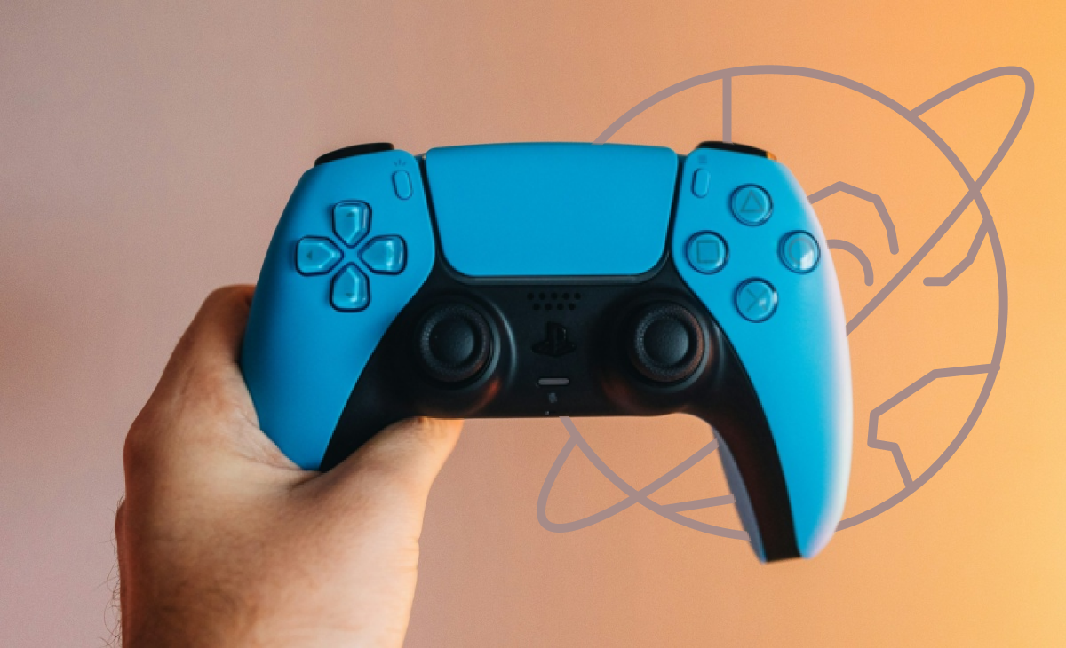 A hand holding a blue and black PS5 DualSense controller against a gradient background with an orbit icon depicting the web