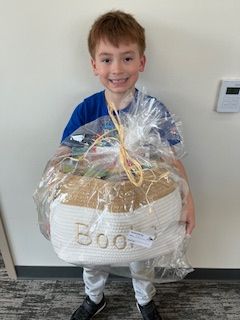Gabriel holding a prize