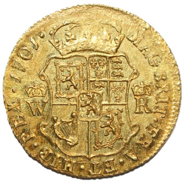 A gold coin with a coat of arms and a crown

Description automatically generated