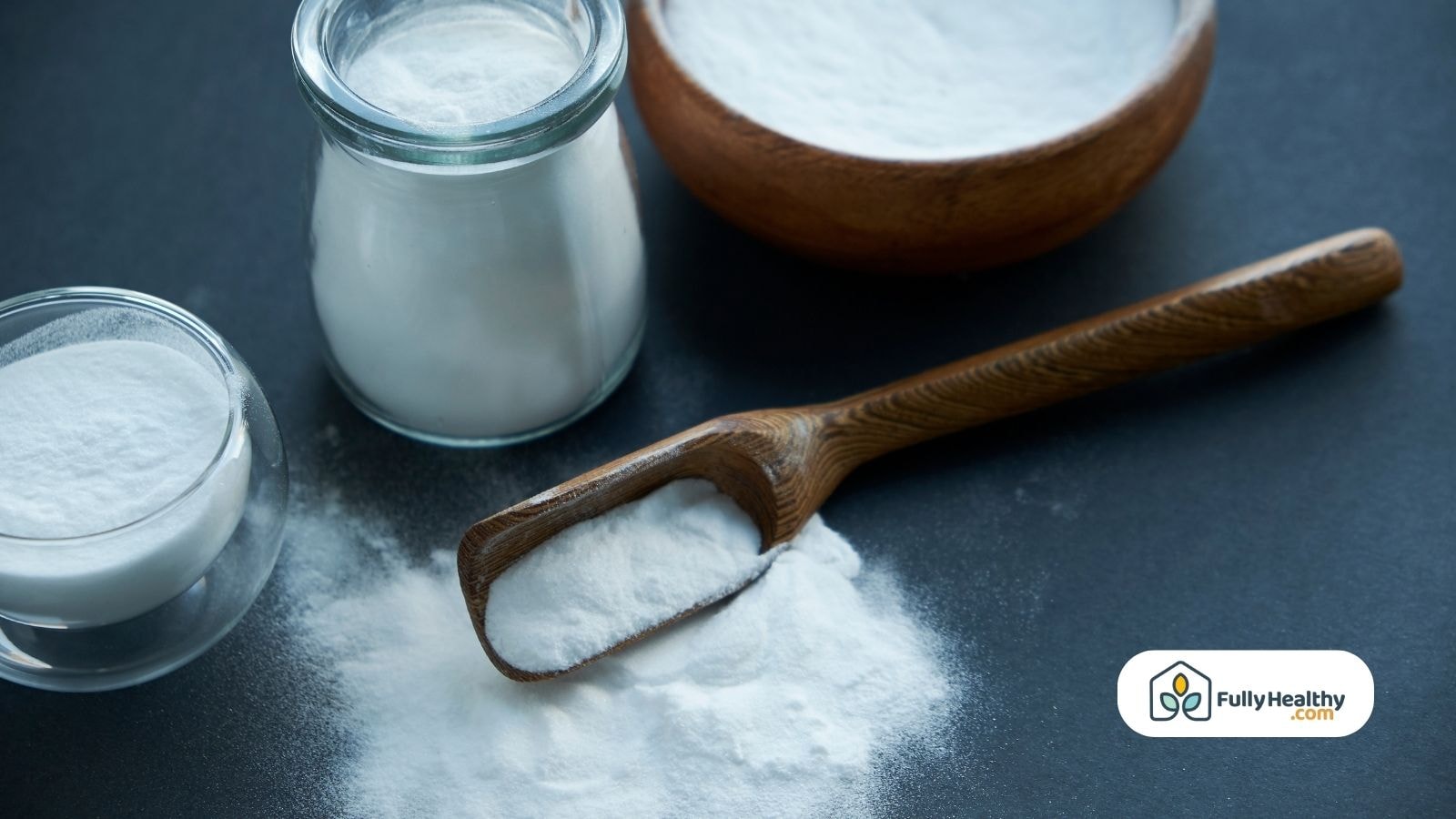 Various containers with baking soda and a wooden spoon.