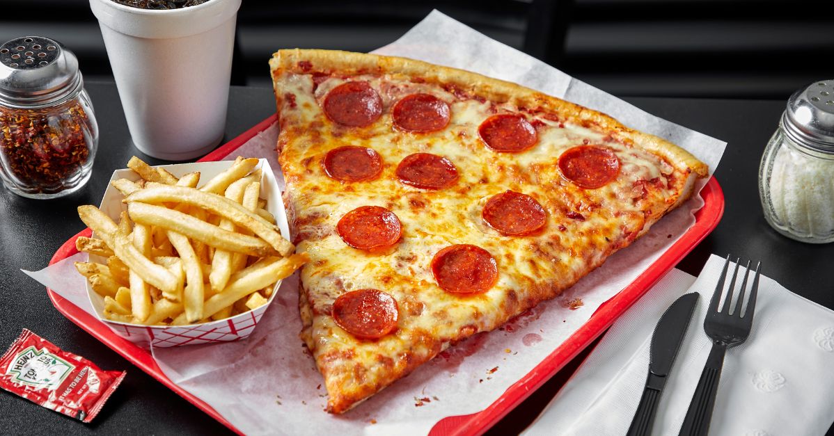 a slice of monster pizza and fries